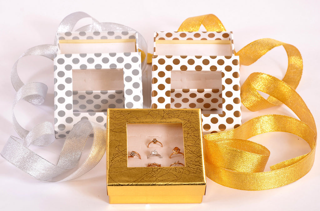 Handcrafted, ring boxes made with bright sheets with luster to cover.