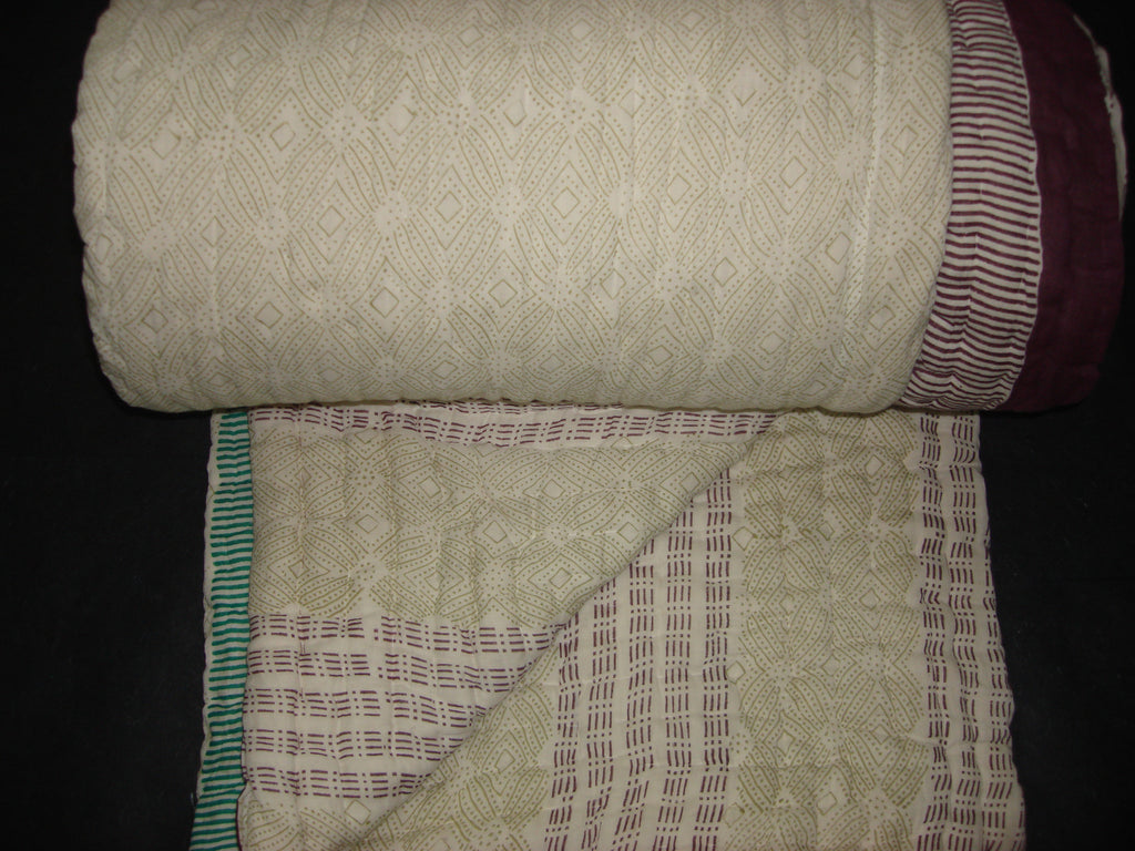 Handmade, reversible, cotton, block printed designer quilt, shades of green and reddish brown.