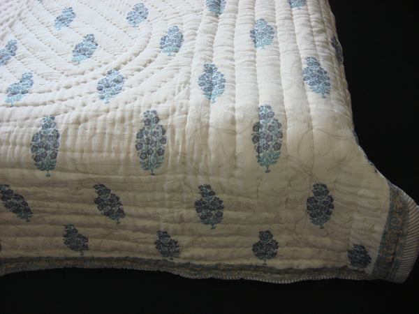 Handmade quilt, cotton, block printed flower bunches in soft blue