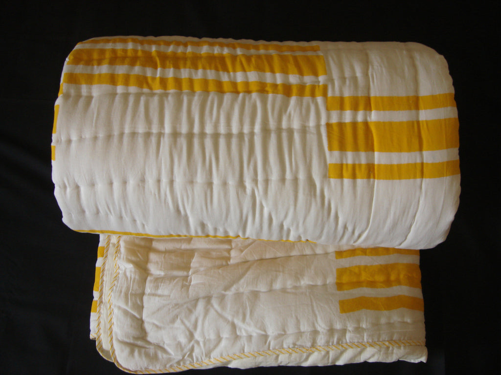 Handmade, reversible, cotton, block printed designer quilt in bold yellow